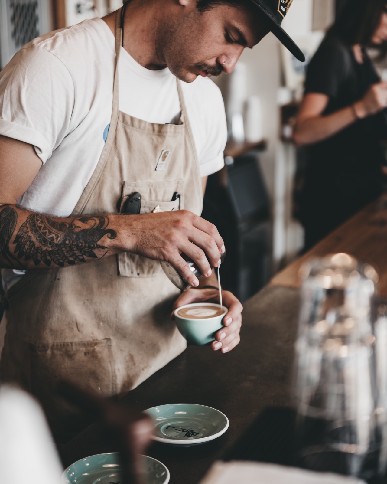 barista making a latte art